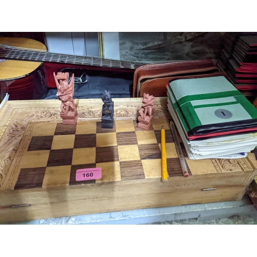 160 - A mixed lot to include a Jose Ferrer El Primo guitar in slip case, a folding box chess set with carv... 