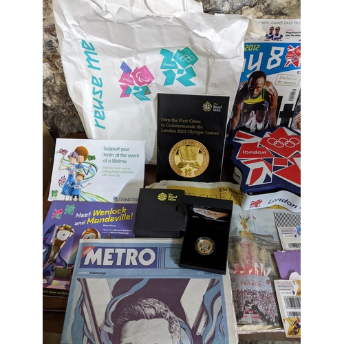 162 - Olympic London 2012 memorabilia to include a cased silver proof £2 coin, box containing various pin ... 