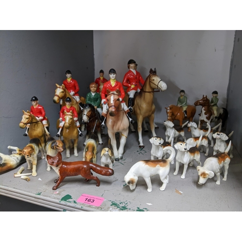 163 - Beswick, Bretby and other model hunting hounds and riders comprising two Beswick riders on ponies, 8... 