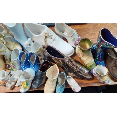 214 - A collection of shoe ornaments and other collectables to include V&A Museum collectable  teapots, We... 