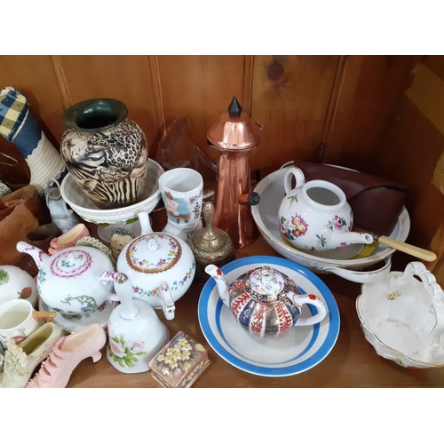 214 - A collection of shoe ornaments and other collectables to include V&A Museum collectable  teapots, We... 