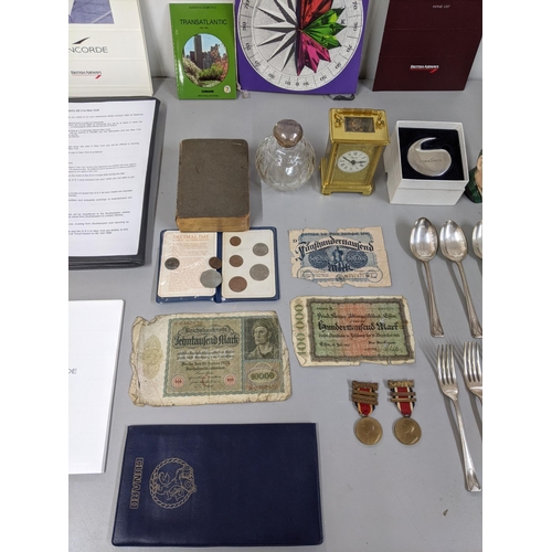 218 - Collectables to include Concord related items, coins, a carriage clock, a silver topped scent bottle... 