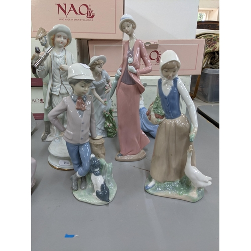 219 - Four boxed Nao Lladro figurines, together with a boxed Nadal figurine, a Lladro Nao Daisa 1987 Girl ... 