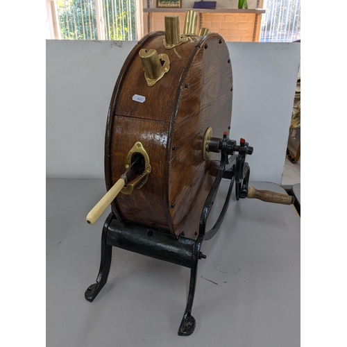 229 - An early 20th century oak and cast iron knife cleaner and sharpener
Location: RWM