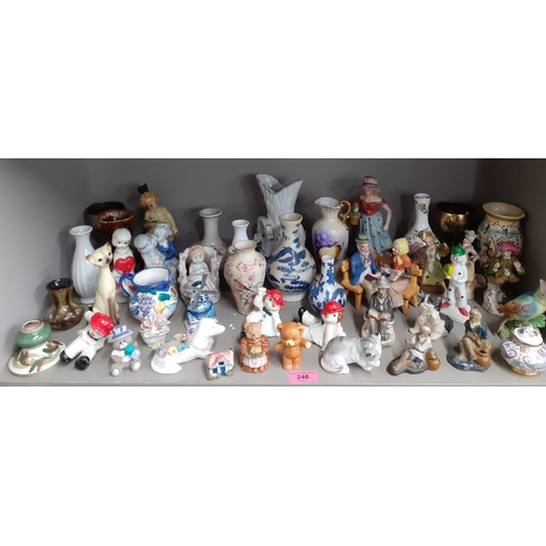 246 - A quantity of 20th century collectables, mainly vases, figures and models of animals to include a Po... 