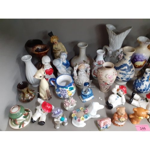 246 - A quantity of 20th century collectables, mainly vases, figures and models of animals to include a Po... 