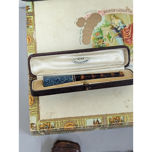 253 - Mixed smoking related items to include cigar box and tin, leather holders, leather embossed vesta ca... 