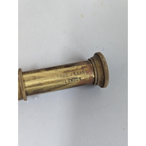 254 - A small brass pocket telescope signed Thomas. J. Evans, London, in fitted box, signed to top
Locatio... 