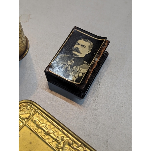 257 - WWI related items to include a 1914 Christmas tin, trench art and a commemorative pin dish along wit... 