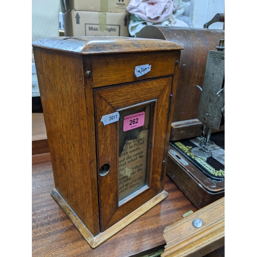 262 - A Victorian oak collection/post box with glazed door having a Longfellow poem to the glazing, on pli... 