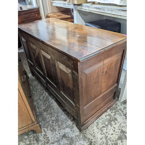 265 - A 19th century oak farmhouse deep wooden chest, panelled front, sides and back, two base drawers, ov... 