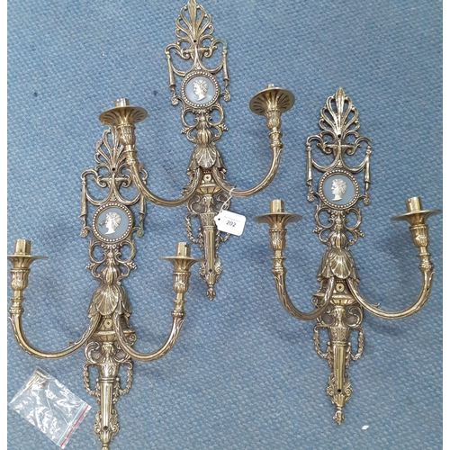 290 - Three late 20th century brass wall lights with inset cameo effect circular plaques
Location: A1F