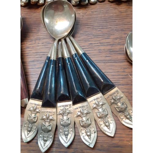 291 - Vintage 'bronzed' and wooden handled cutlery and flatware together with six Thai spoons with images ... 