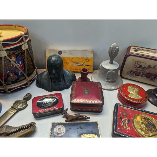 303 - A mid lot to include a Boer War 1900 South Africa chocolate tin, composition bust of Sir Winston Chu... 