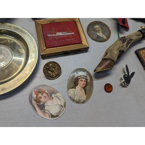 303 - A mid lot to include a Boer War 1900 South Africa chocolate tin, composition bust of Sir Winston Chu... 