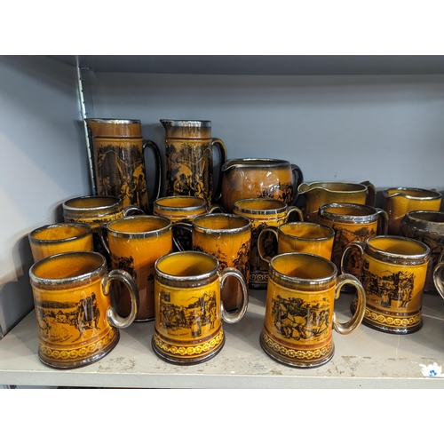 306 - A large collection of Ridgways 'Coaching Days' ceramics to include jugs, tankards, beakers, plates, ... 