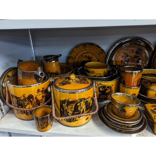 306 - A large collection of Ridgways 'Coaching Days' ceramics to include jugs, tankards, beakers, plates, ... 