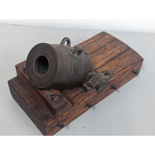 320 - An early to mid 20th century bronze model of a Cannon Mortar on oak stand, 22.5cm (Mortar approx 12c... 