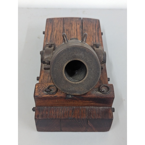 320 - An early to mid 20th century bronze model of a Cannon Mortar on oak stand, 22.5cm (Mortar approx 12c... 