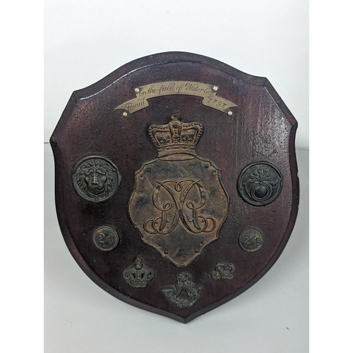 321 - Waterloo interest, cap badges reputedly found in the field of Waterloo in 1898 to include British Sh... 