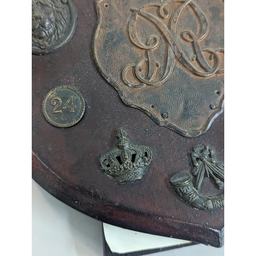 321 - Waterloo interest, cap badges reputedly found in the field of Waterloo in 1898 to include British Sh... 