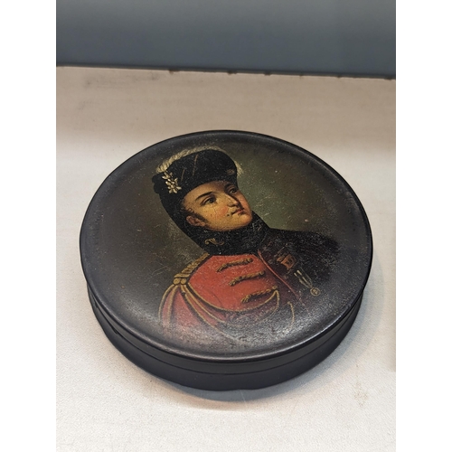 322 - A 19th century ebonised papier mache snuff box, with a portrait of The Prince of Orange, together wi... 