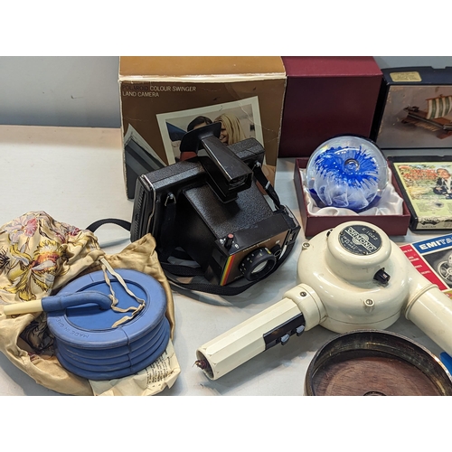 327 - A mixed lot to include a boxed Polaroid camera, electronic chess set, vintage games, model Carthagin... 