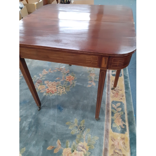 333 - A Regency inlaid mahogany tea table with a foldover top on square tapered legs
Location: A2B