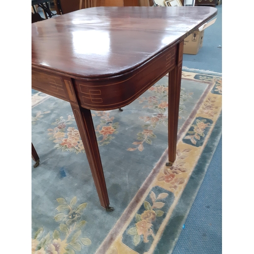 333 - A Regency inlaid mahogany tea table with a foldover top on square tapered legs
Location: A2B