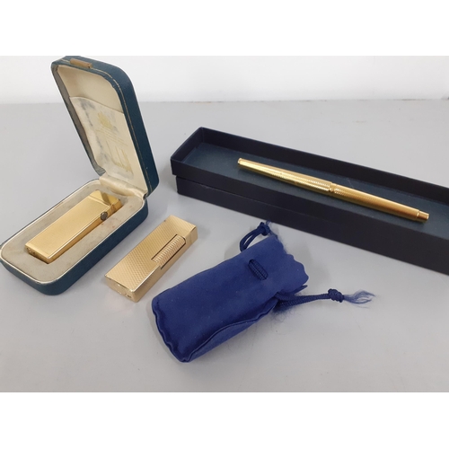 336 - Two gold plated Dunhill cigarette lighters and a gold plated Parker fountain pen
Location: CAB3