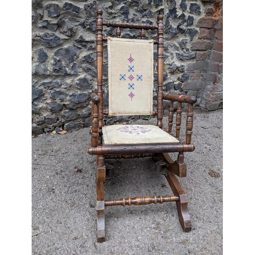 352 - A late 19th century American style child's rocking chair with tapestry panel seat and back
Location:... 