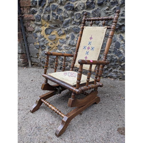 352 - A late 19th century American style child's rocking chair with tapestry panel seat and back
Location:... 