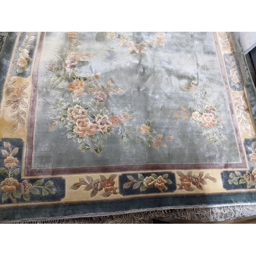 41 - A Chinese handwoven silk blue ground rug 183cm x 274cm Location: A3F