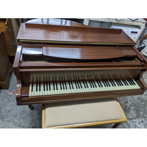 42 - A Challen mahogany cased baby grand piano, on square tapering legs and casters, along with a duet pi... 