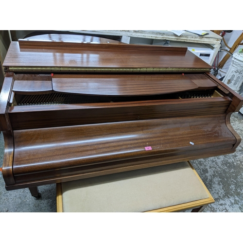 42 - A Challen mahogany cased baby grand piano, on square tapering legs and casters, along with a duet pi... 