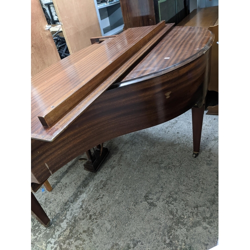 42 - A Challen mahogany cased baby grand piano, on square tapering legs and casters, along with a duet pi... 