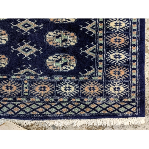 46 - A small Bokhara blue ground rug, 155cm x 96cm
Location: SR