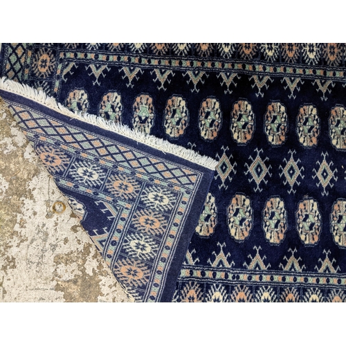 46 - A small Bokhara blue ground rug, 155cm x 96cm
Location: SR