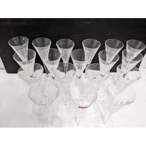 52 - Jasper Conran designed for Stuart Crystal a set of eighteen tall cut glass champagne flutes, each wi... 