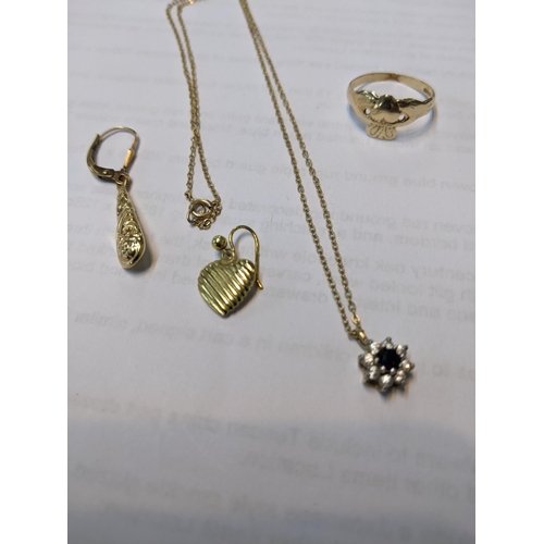 56 - Mixed 9ct gold jewellery to include a pendant set with a central blue sapphire surrounded by eight w... 