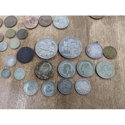 61 - A mixed lot of mainly British commemorative and coinage to include a 1924 British Exhibition medal, ... 