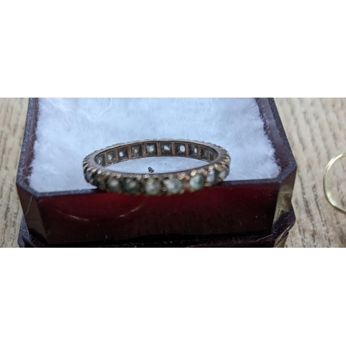 63 - A 9ct gold band, 2.6g, 9ct gold full eternity ring set with approx 24 white stones (possibly white s... 