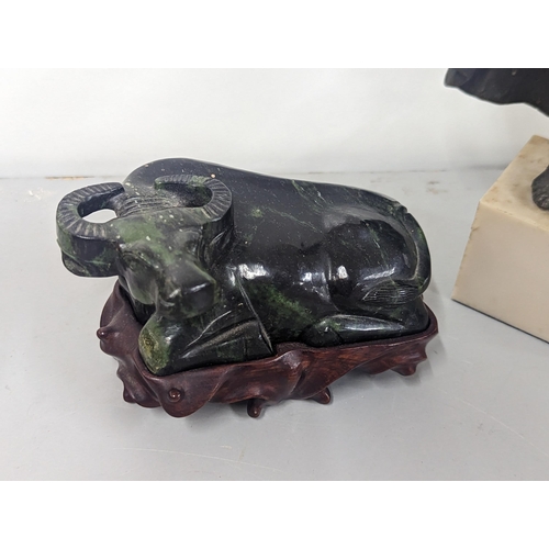 81 - A jade coloured model of an ox on base, together with a composition figure A/F
Location: 6.1