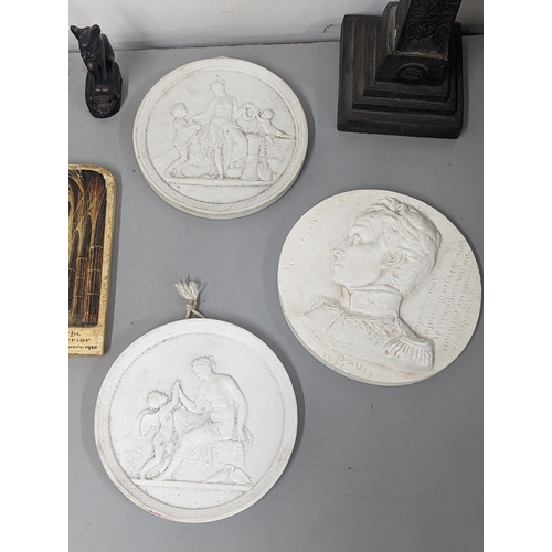 83 - A mixed lot to include Classical Bisque style plaques and others, along with a replica Phestas Discu... 