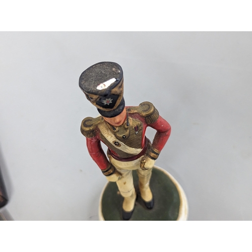 86 - A pair of 19th century figures of British Soldiers, one Coldstream Guards example A/F, a bust of Nap... 