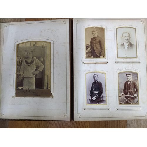 87 - A Victorian leather bound photograph album containing various late Victorian photographs of various ... 