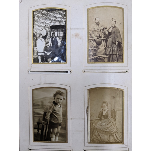 87 - A Victorian leather bound photograph album containing various late Victorian photographs of various ... 