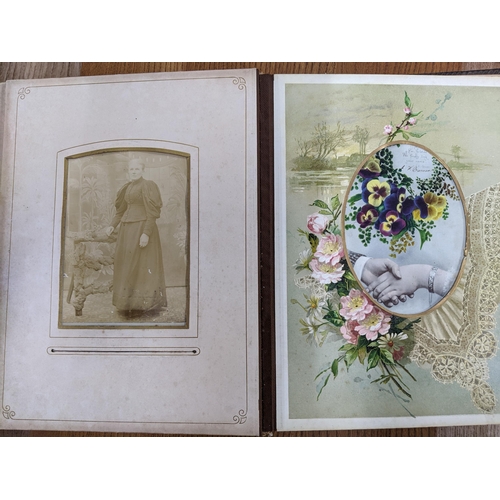 87 - A Victorian leather bound photograph album containing various late Victorian photographs of various ... 