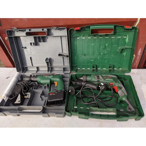 176 - Two boxed Bosch drills to include a PSB 12 VSP-2 and a PSB 1000 RE 
Location: CON