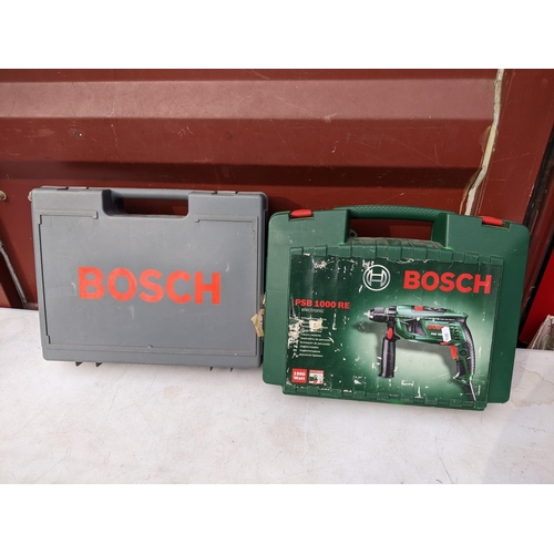 176 - Two boxed Bosch drills to include a PSB 12 VSP-2 and a PSB 1000 RE 
Location: CON